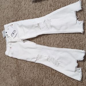 White distressed bell bottom jeans
